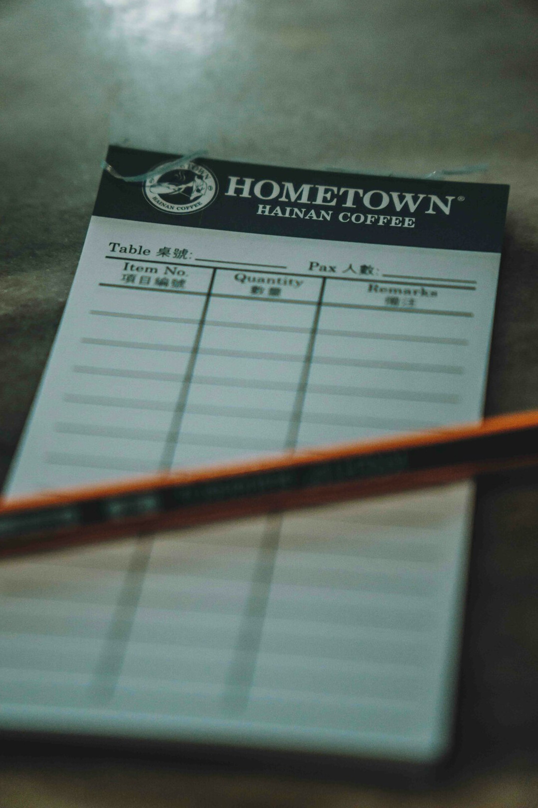 Survey questionnaire on a clipboard with a pen on a wooden desk