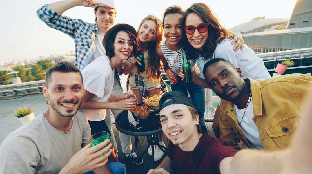 diverse young people smiling in city