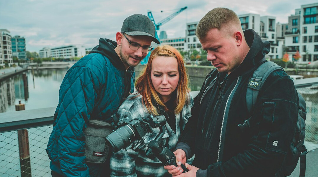 group of friends discussing plans outdoors