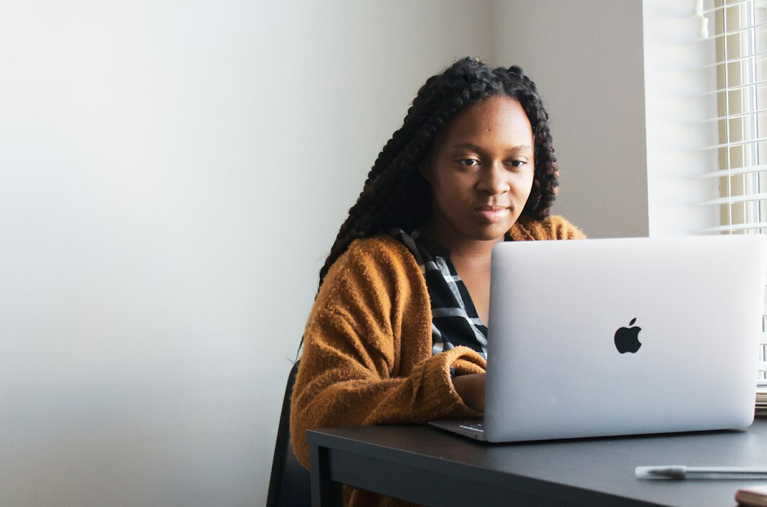 young woman using laptop for research